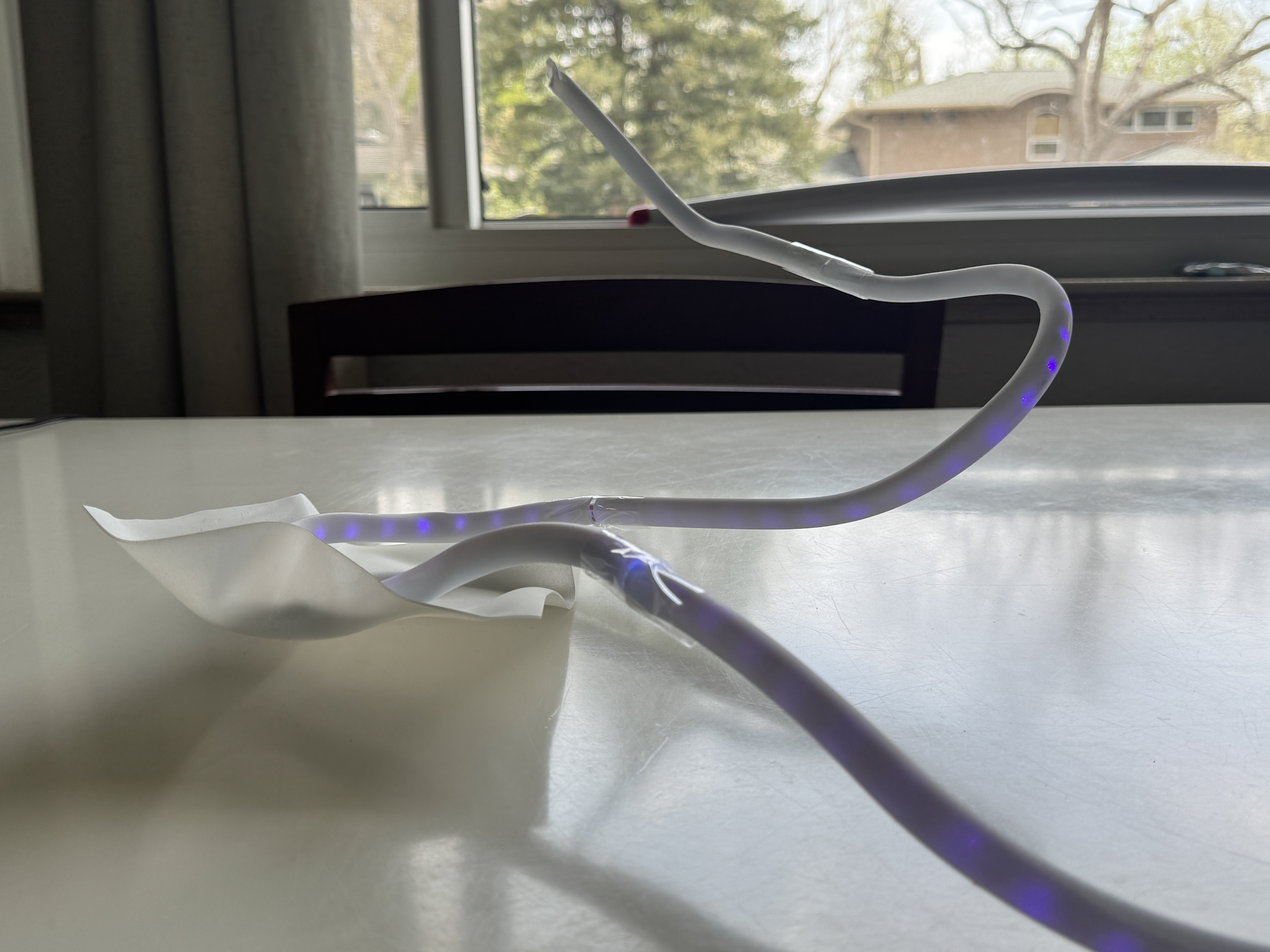 Echo sculpture displaying competition dance movement through LED lights in acrylic tube